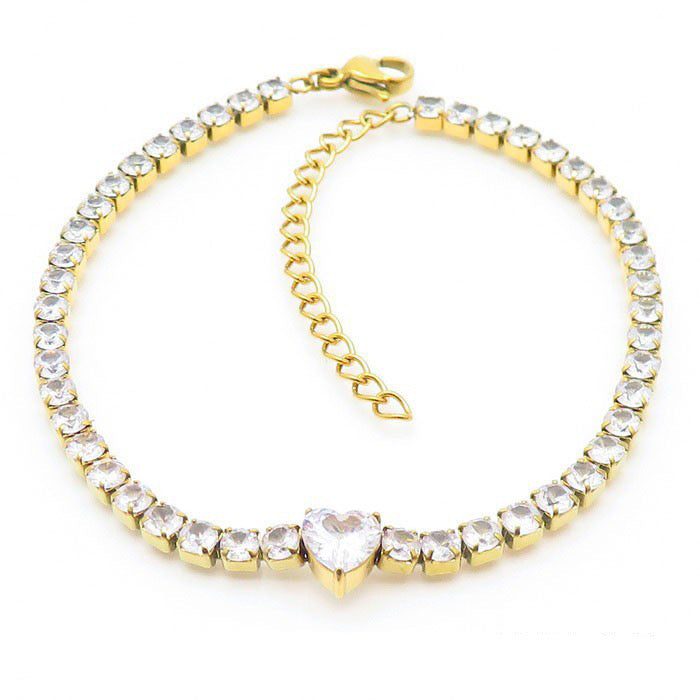 Goldenes Tennisarmband mit Herzstein