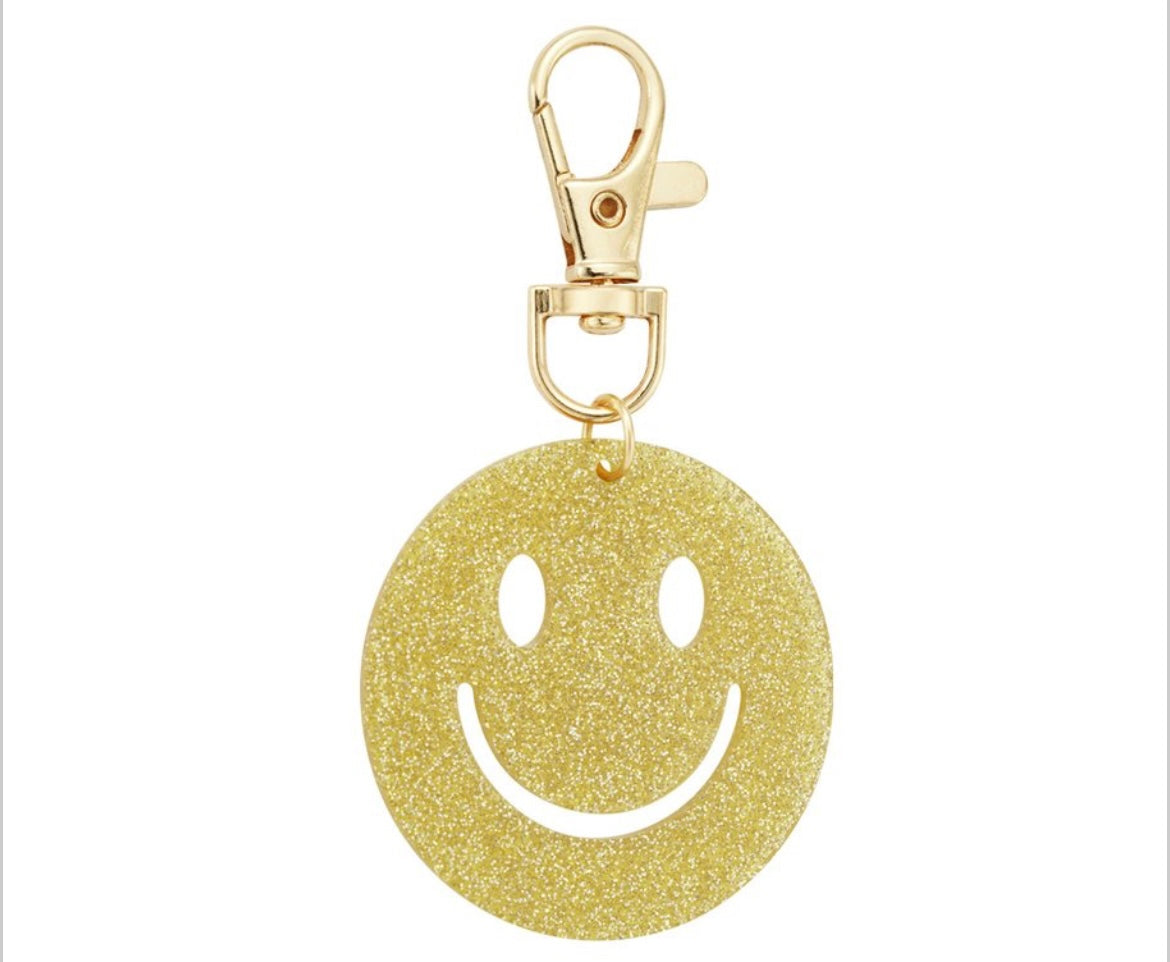 Glitzernder Smiley-Anhänger in gold mit Karabiner