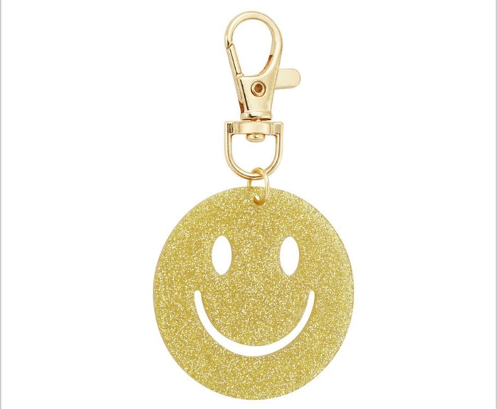 Glitzernder Smiley-Anhänger in gold mit Karabiner