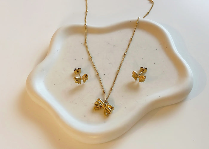 Schleifenohrringe gold