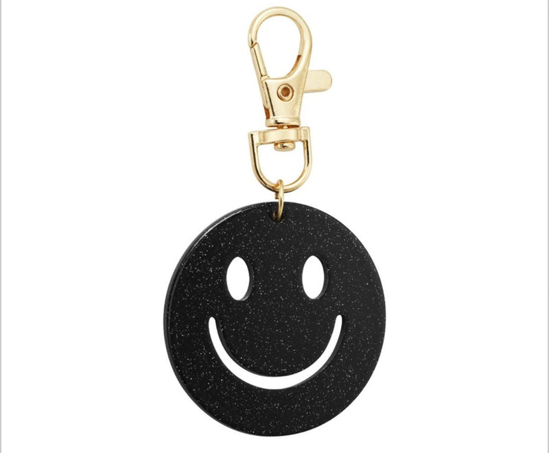 Glitzernder Smiley-Anhänger in schwarz mit Karabiner